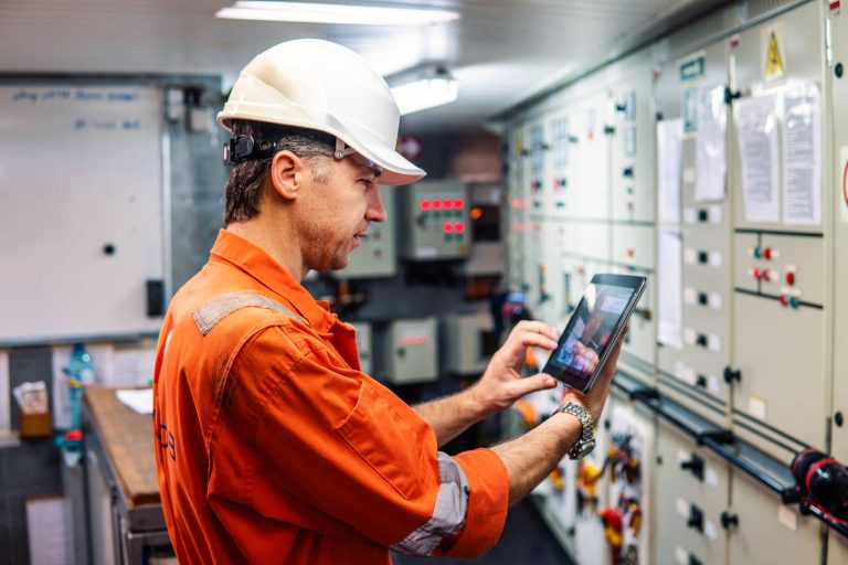 marine-chief-engineer-watching-digital-tablet-in-e-2025-02-12-16-13-28-utc